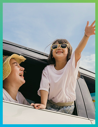 Mom and daughter happy in car