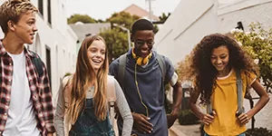 Couple in a home with packing boxes in the foreground.