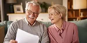 Guy using a tap credit card to pay at a restaurant.